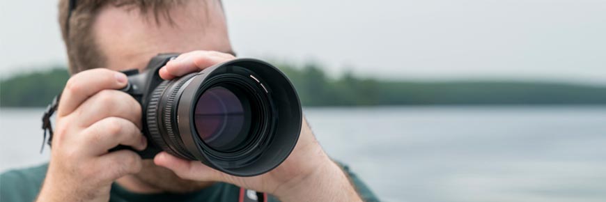 A Parks Canada team member takes a photo