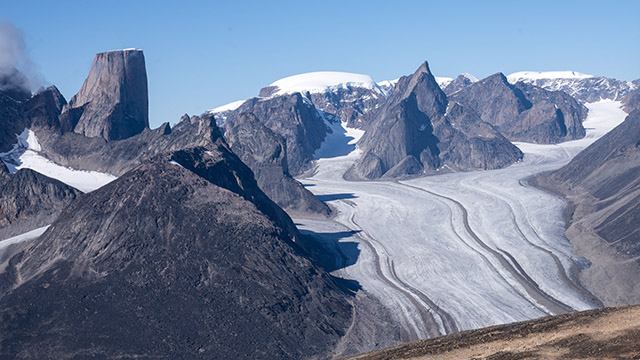 Aerial photo of Turner Glacier in Auyuittuq National Park, with impressive flat-topped Mount Asgard behind in the left of the photo, and Mount Loki on the right.