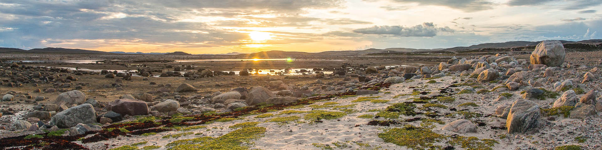 The sun overlooking Wager Bay and the tundra