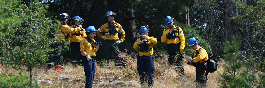 Park firefighting staff prepare group together before a prescribed fire. 