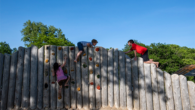 Children climbing on the playground at Northwest Beach