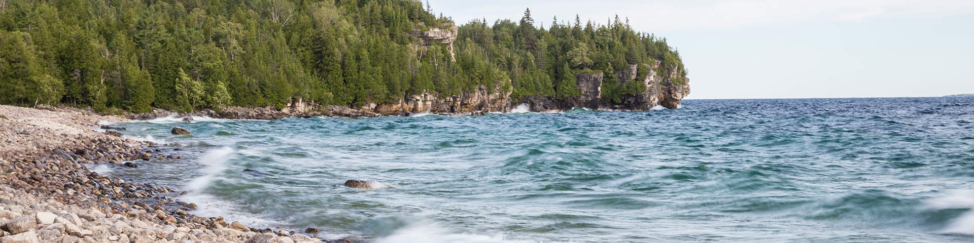 Rocky shoreline with waves