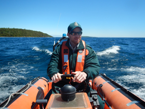 Park warden driving a boat