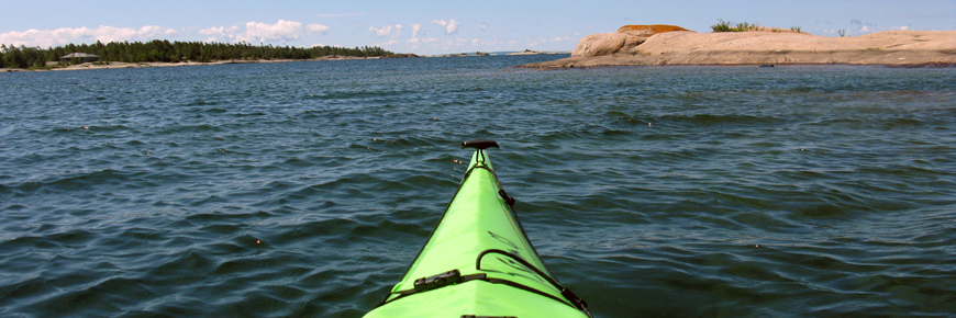 A kayak glides through the water.