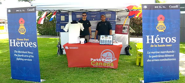 Alex Findlay and Benn Fisher working the Home Port Heroes exhibit at the Sault Canal