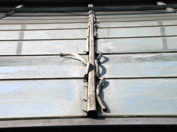 Previously there were concerns that the glass cladding might slide down and that the wood lacked metal capping to protect it from the elements.