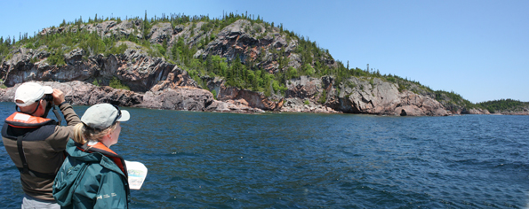Project Peregrine Lead, Dr. Brian Ratcliff, and Park Ecologist, Christine Drake, search for nesting sites near Otter Island