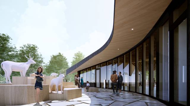 A modern architectural design rendering of a curved building with large glass windows. The exterior area includes life-sized statues of a deer and a bear on tiered wooden platforms. People are walking and interacting in the space.