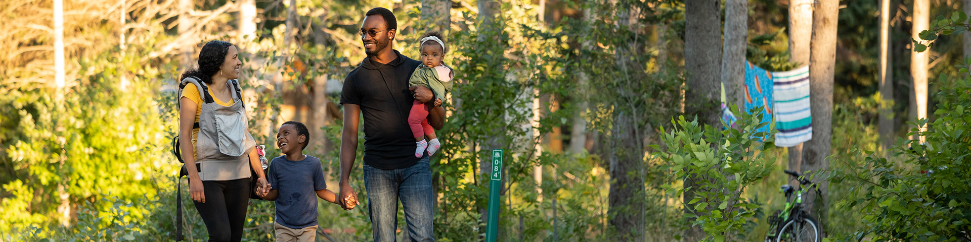 A family walks through Stahnope campground