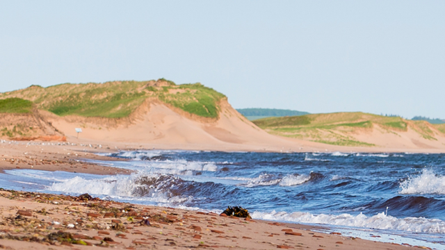 Waves crash on the shore at Cavendish Campground beach.