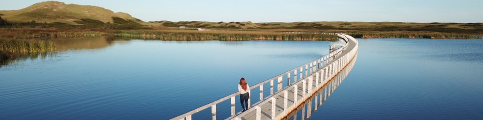 Walk along the floating boardwalk to Greenwich dunes