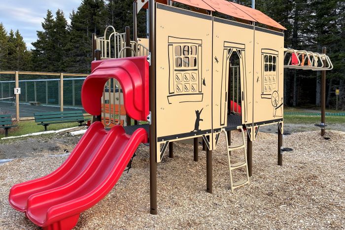 Playground game showing a cabin and a slide.