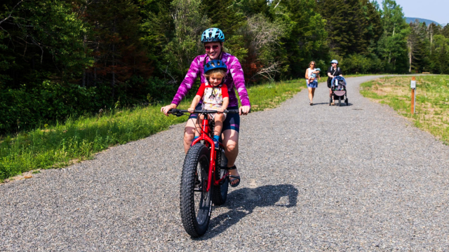 A mother and her child on a fatbike.