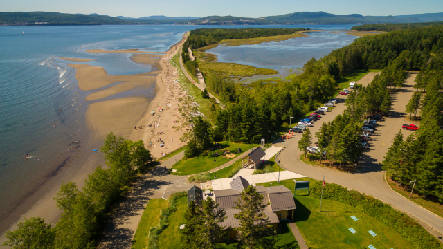 Aerial view of Penouille area with its visitor centre, parking lot and sand spit.