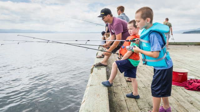 Fishermen on a quay.