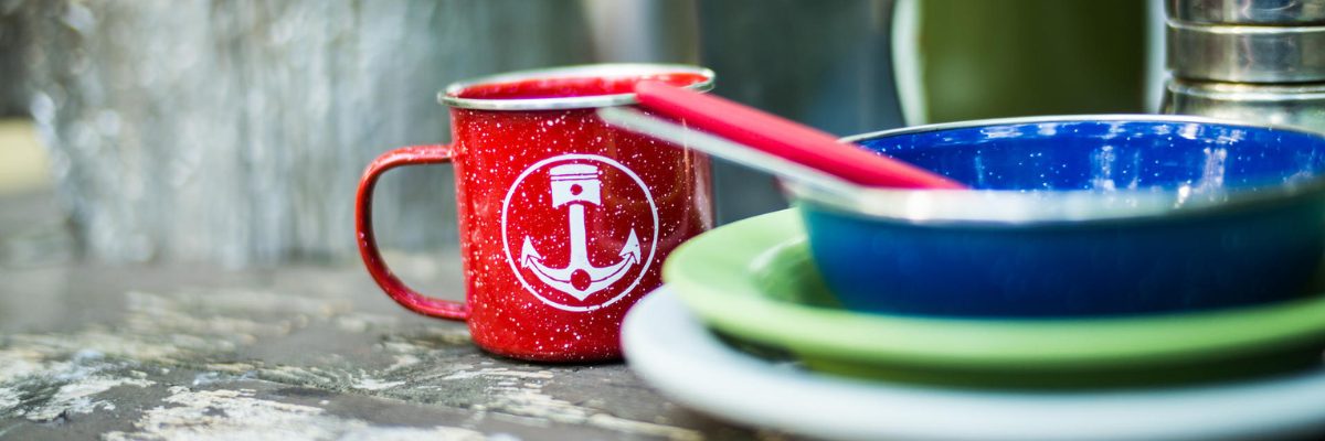 Dishes on a picnic table.