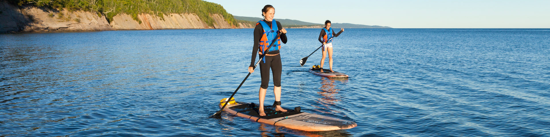 Two visitors enjoying their paddleboard near Penouille sand spit.