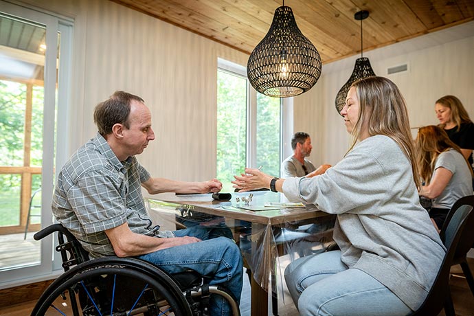 Visitors playing society games in the dinning-room.