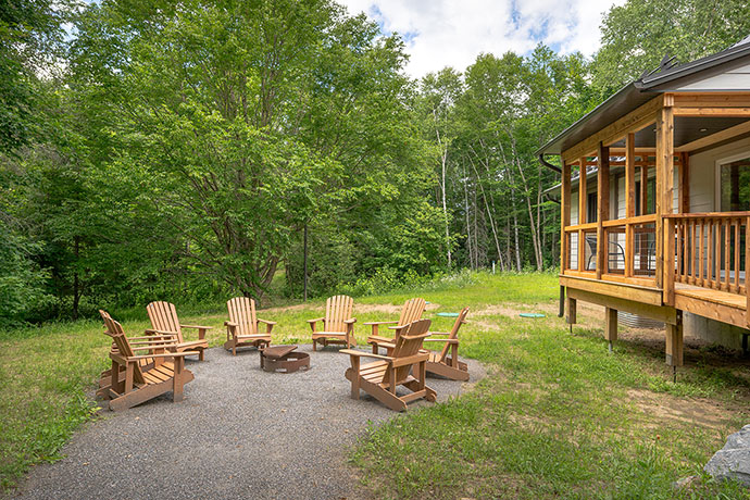 Chairs disposed around a fire pit.