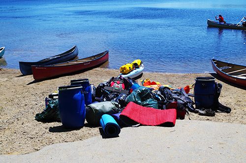 Canoes and equipment on a beach