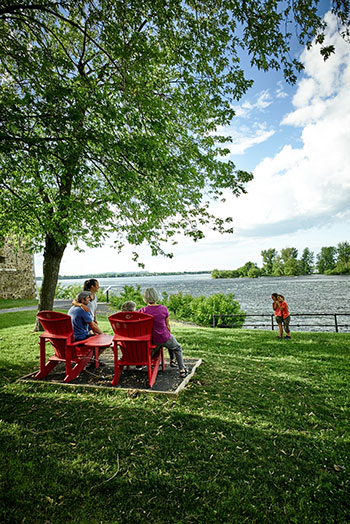 A family in the red chairs at Fort Chambly