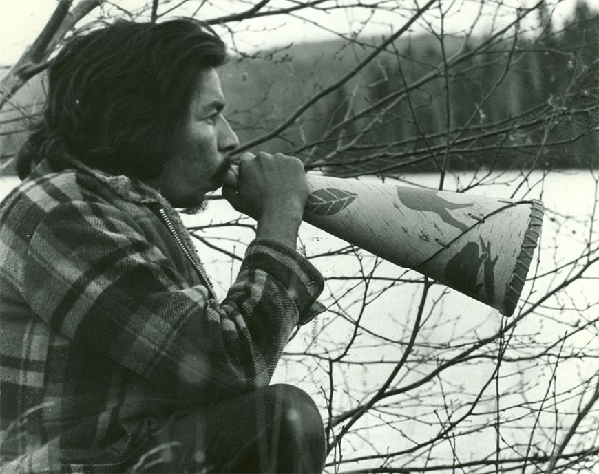 A man using a blow horn.