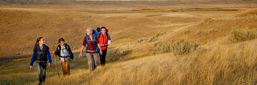 A group of visitors on a hike in the West Block of Grasslands National Park.