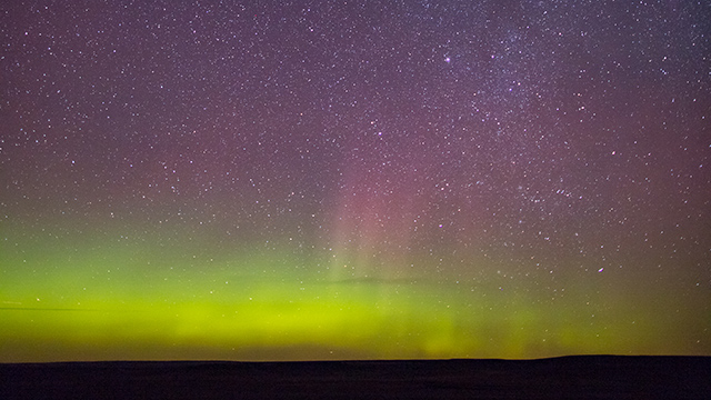 Dark Sky Milky Way and Aurora Borealis at night in the Dark Sky Preserve, in Grasslands National Park.