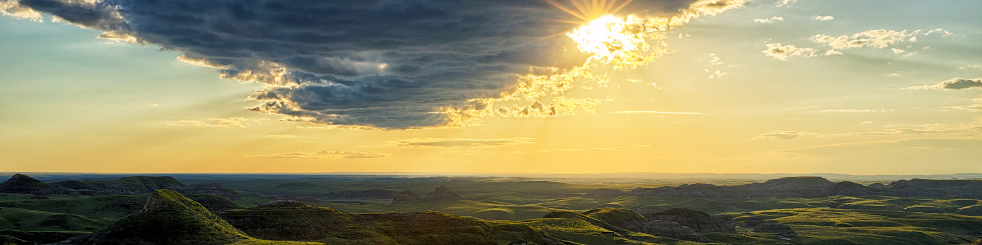 The sun sets on the rugged hills of the badlands in the East Block