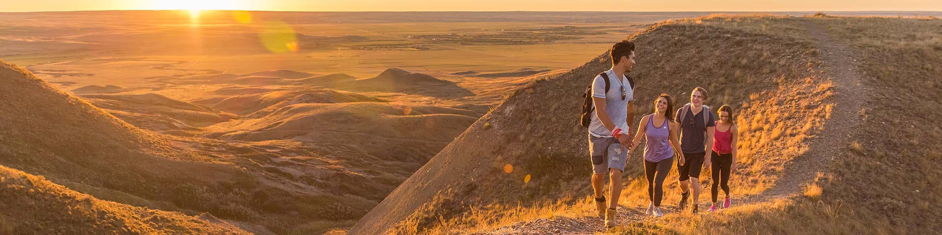 Young adults out hiking on the 70 Mile Butte Trail at West Block, in Grasslands National Park