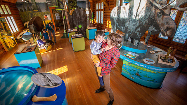 Visitors explore the Parks Canada Nature Centre in Waskesiu in Prince Albert National Park.