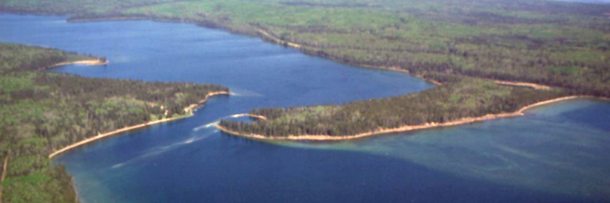 A scenic aerial photograph of the narrows on Waskesiu Lake.