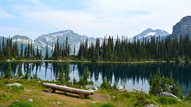 Eva Lake with mountains in the background in Mount Revelstoke.