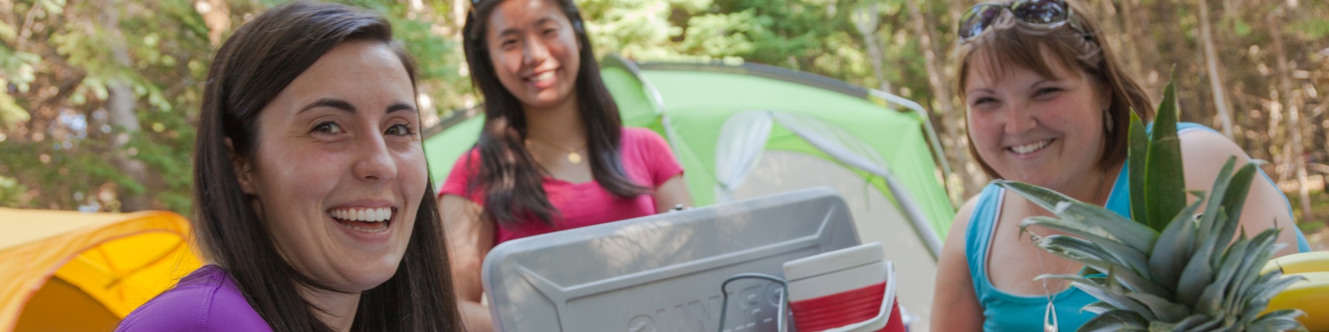 Women prepare food in camping at South Kouchibouguac campground.