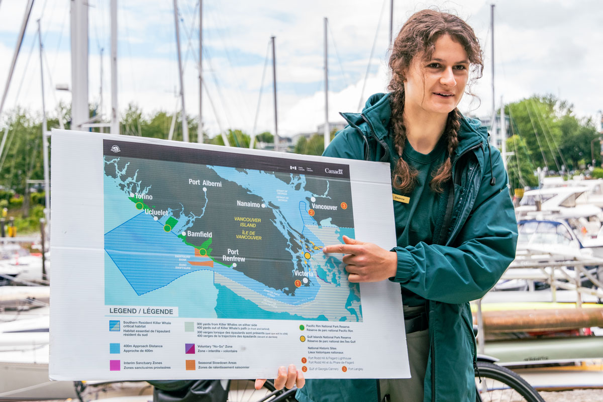 Parks Canada team member pointing at a map