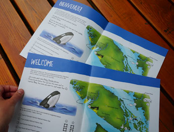 Cahier d'activités ouvert à la première page. On y voit un épaulard et une carte de la côte sud de la Colombie-Britannique.