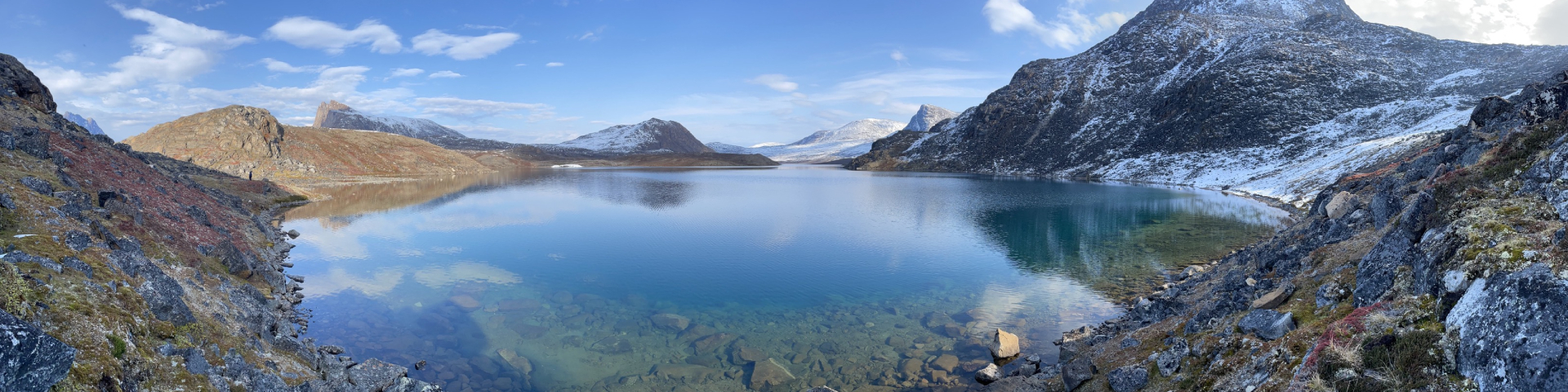 Naaqpait Tasinga Lake with mountains in the background at Auyuittuq National Park.