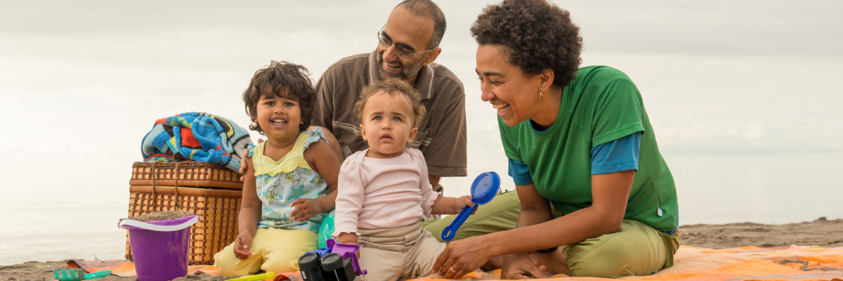 A family plays on the beach at Rouge National Urban Park