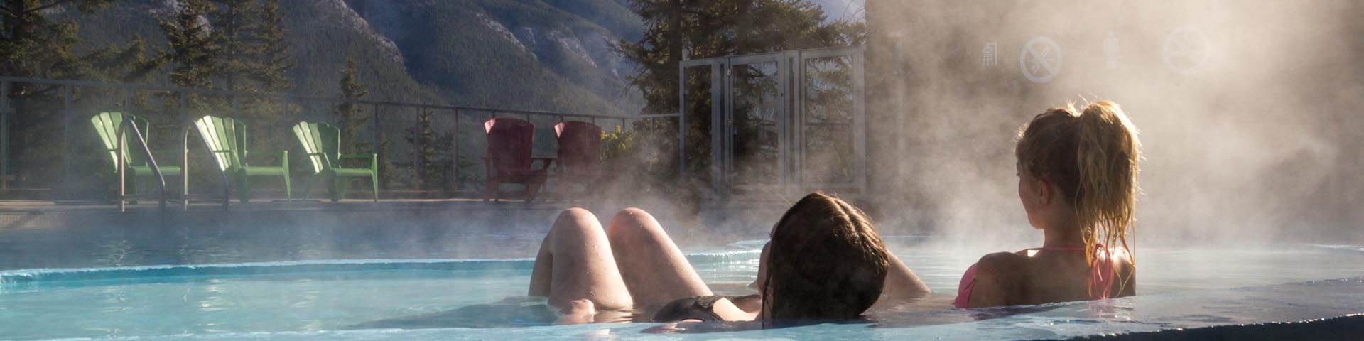 Two young women relaxing in the Banff Upper hot Springs